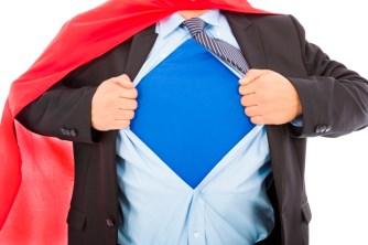 Businessman pulling his t-shirt open in white background