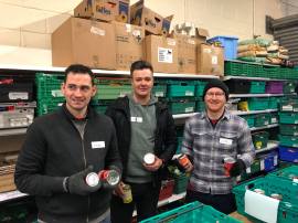 volunteers sorting out the tins of soup in the warehouse